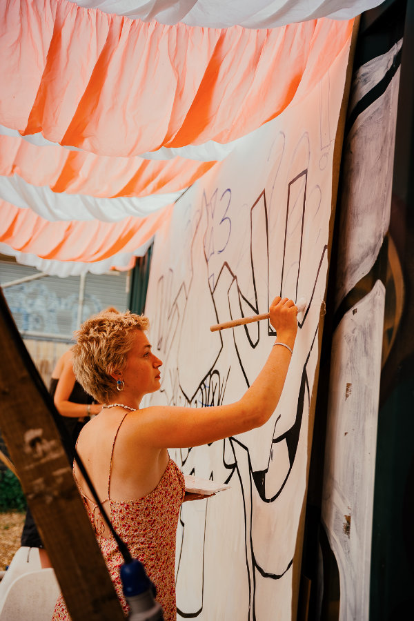 Wall art being drawn at Seasoning Festival 2026, Stroud