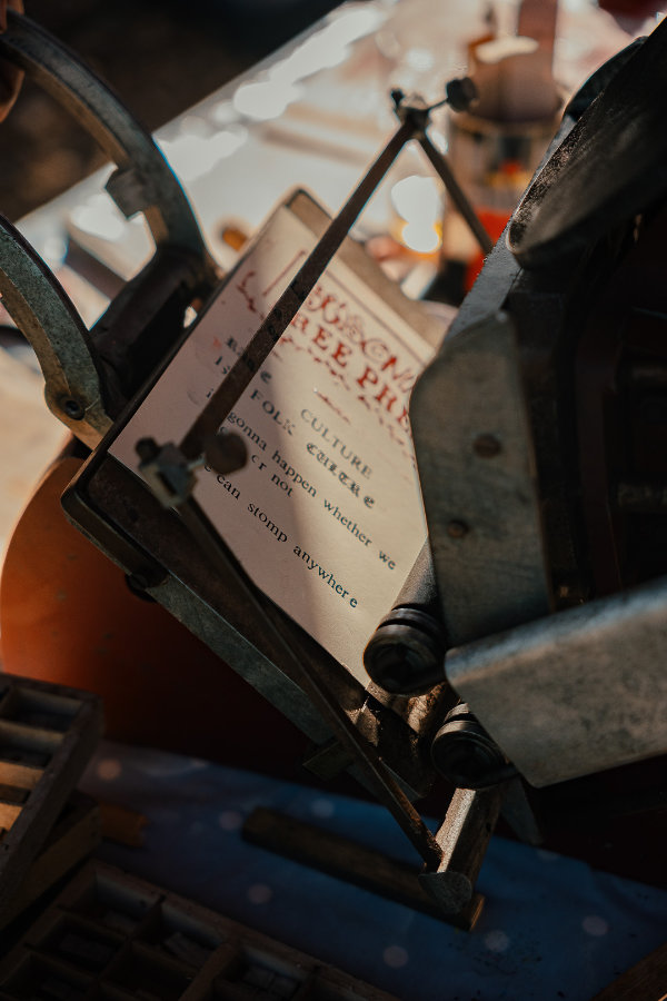 Printing press beig used at Seasoning Festival 2026, Stroud