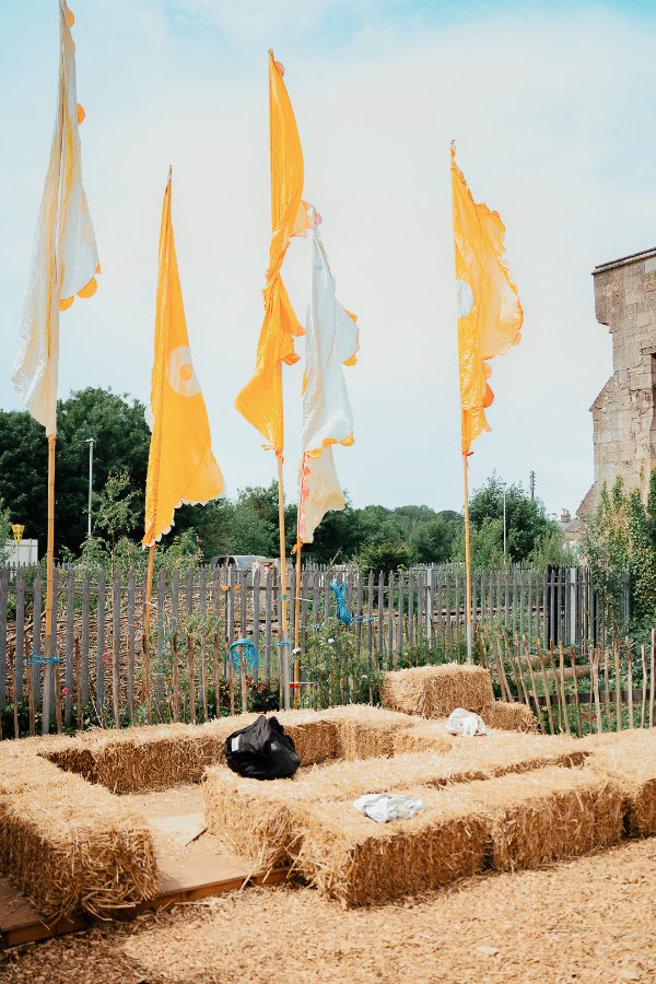 Hay bales and fabric flags at Seasoning Festival 2026, Stroud